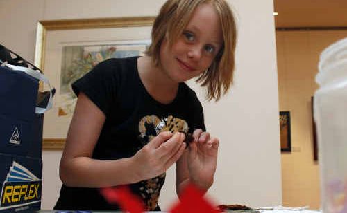 Laura Spooner makes a dragon with pieces of fabric and plenty of glue. Laura Spooner makes a dragon with pieces of fabric and plenty of glue.